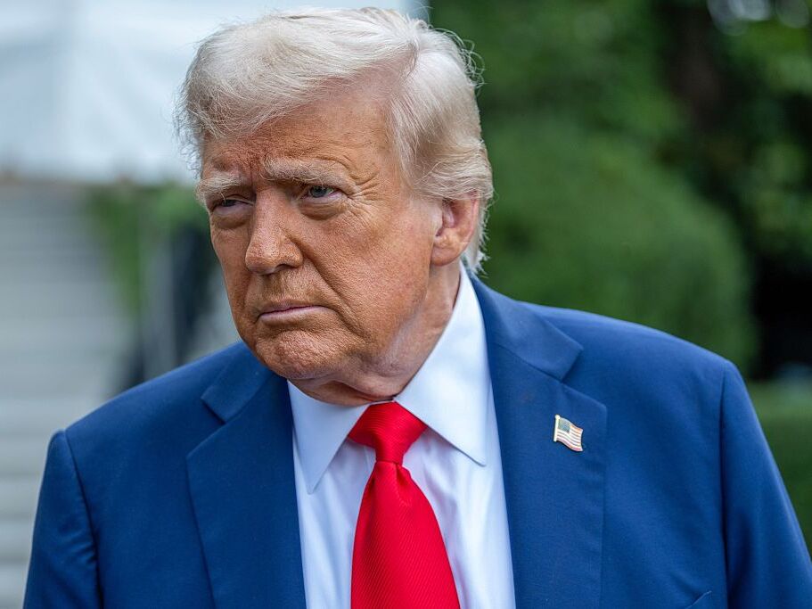 caption: President Trump talks to the media before boarding Marine One on the South Lawn of the White House on Sunday in Washington, D.C.