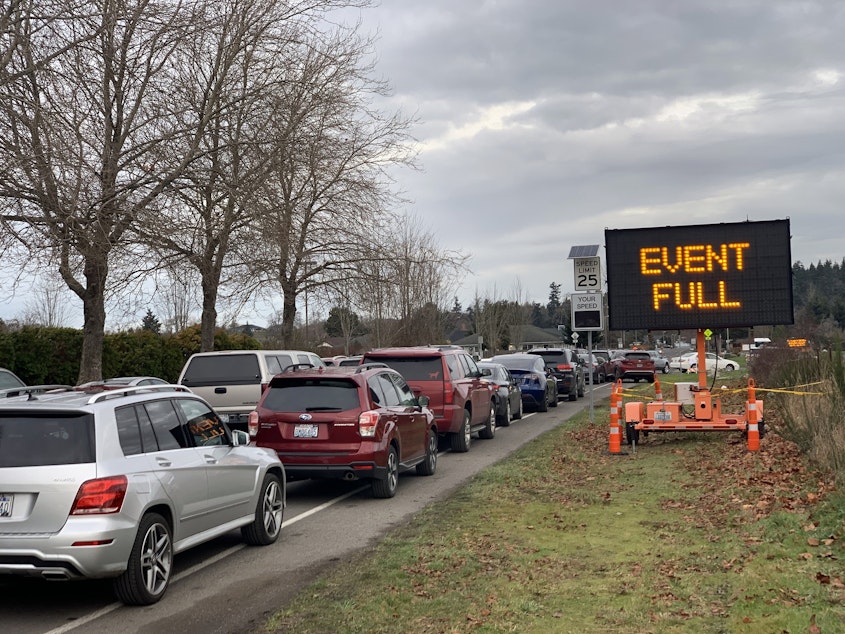 caption: File photo. Eager seniors filled up all of the first come, first serve slots at a drive-thru COVID vaccination clinic before the first shots were even given on Thursday, Jan. 14, 2021, in Sequim, Washington. 