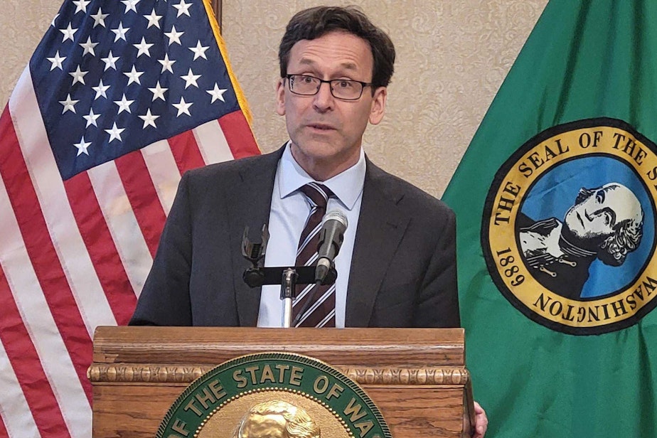 caption: In this file photo, Washington Gov. Bob Ferguson answers questions at a news conference Tues. April 1, 2025.