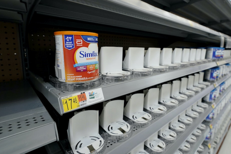 caption: Shelves typically stocked with baby formula sit mostly empty at a store in San Antonio, Tuesday, May 10, 2022.