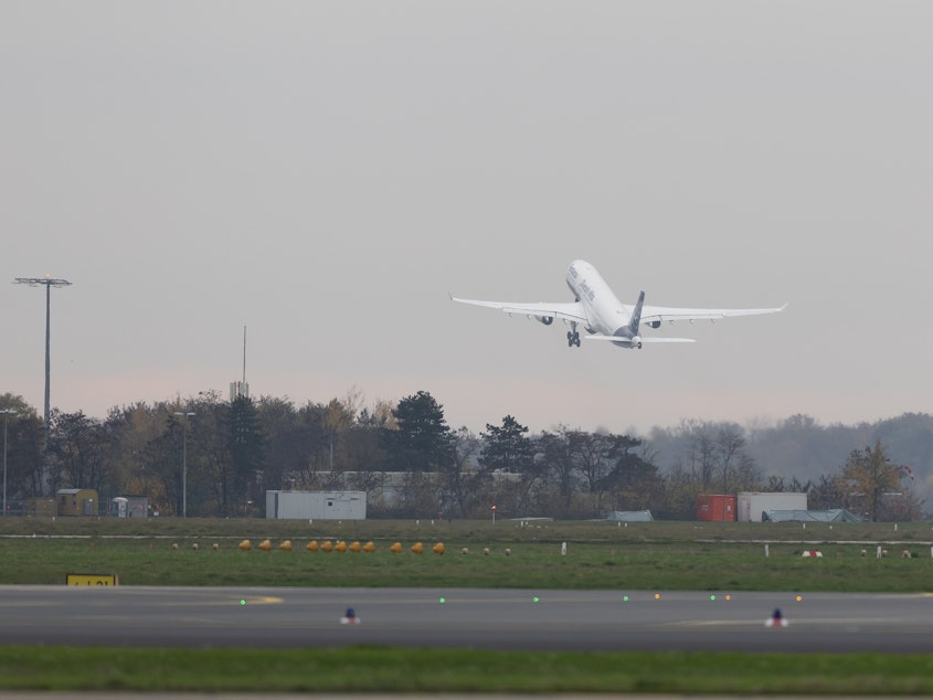 caption: A Lufthansa Airbus A330 D-AIKQ takes off on Nov. 14, 2022. This past week, seven people were sent to the hospital with turbulence-related injuries on a Lufthansa flight.