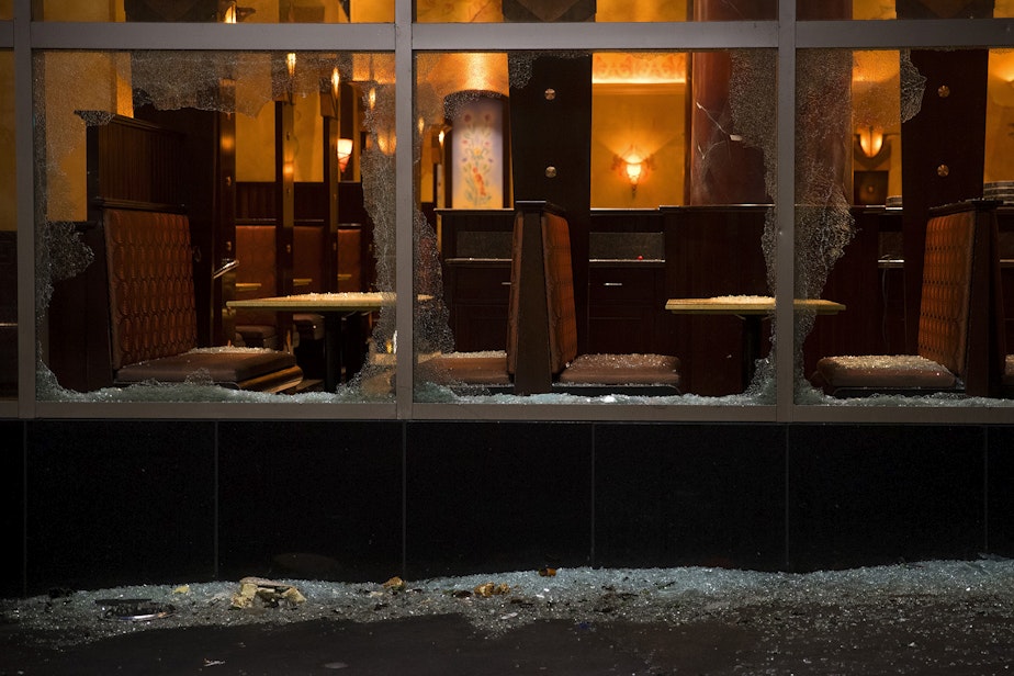 caption: Shattered windows are shown at the Cheesecake Factory following a protest on Saturday, May 30, 2020, on Pike Street in Seattle. Protesters gathered to express outrage at the violent police killing of George Floyd, a Black man who was killed by a white police officer who held his knee on Floyd's neck for 8 minutes and 46 seconds, as he repeatedly said, 'I can't breathe,' in Minneapolis on Memorial Day. 
