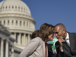caption: Speaker of the House Nancy Pelosi, D-Calif., speaks with Rep. Hakeem Jeffries, D-N.Y., during a news conference with House Democrats about the Build Back Better legislation, outside of the Capitol in 2021.