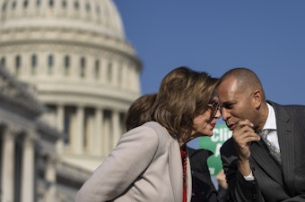 caption: Speaker of the House Nancy Pelosi, D-Calif., speaks with Rep. Hakeem Jeffries, D-N.Y., during a news conference with House Democrats about the Build Back Better legislation, outside of the Capitol in 2021.