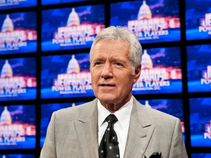 caption: Jeopardy! host Alex Trebek is seen during a 2012 rehearsal. Next month, the U.S. Postal Service is releasing a Forever Stamp honoring Trebek, who died in 2020.
