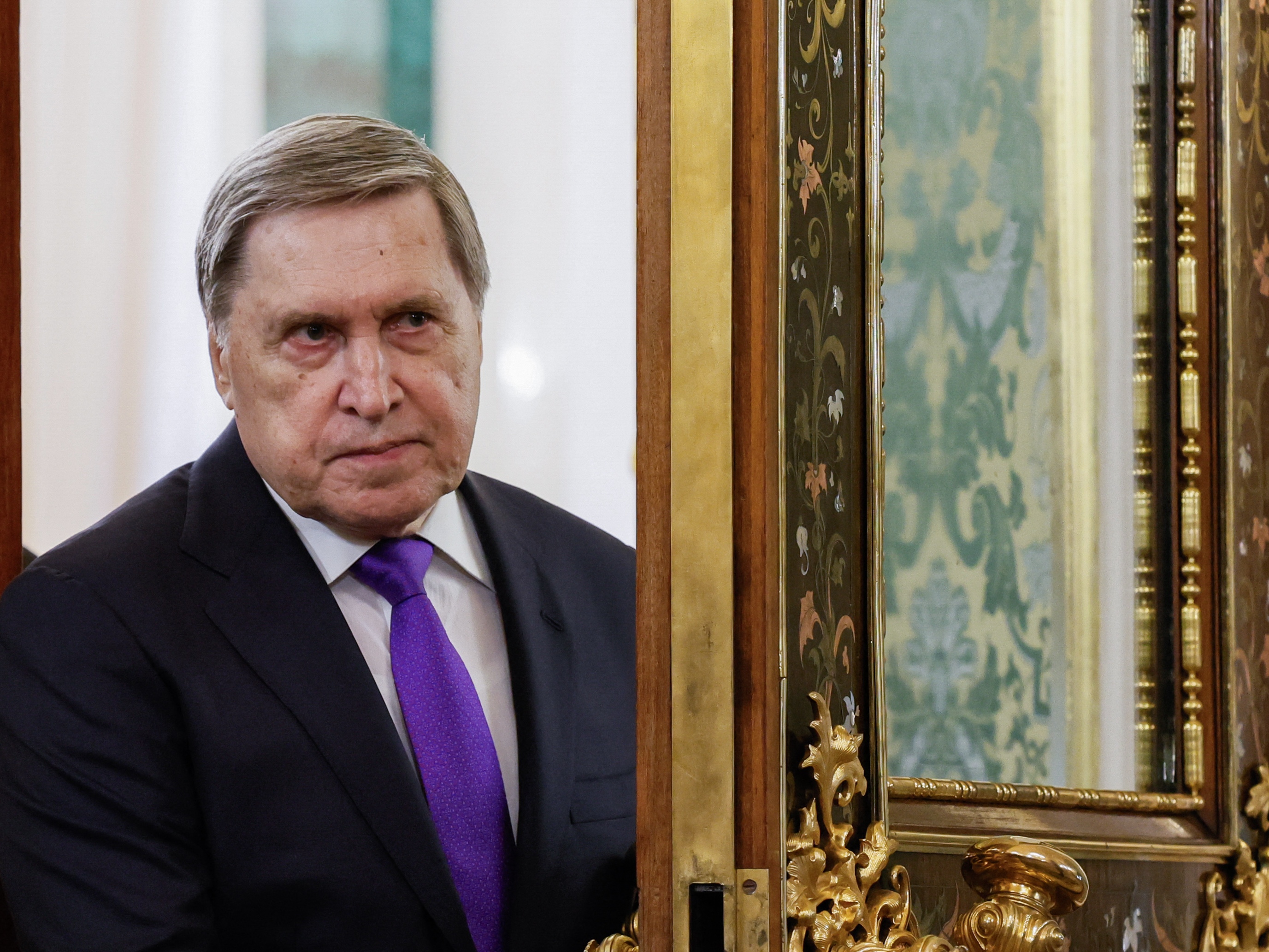 caption: Kremlin aide Yuri Ushakov attends a meeting of the presidents of Russia and Belarus at the Kremlin in Moscow on Thursday.