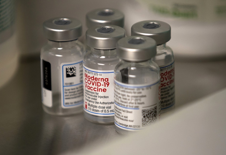 caption: Vials of the Moderna Covid-19 vaccine are shown on Wednesday, December 23, 2020, at EvergreenHealth Medical Center in Kirkland.