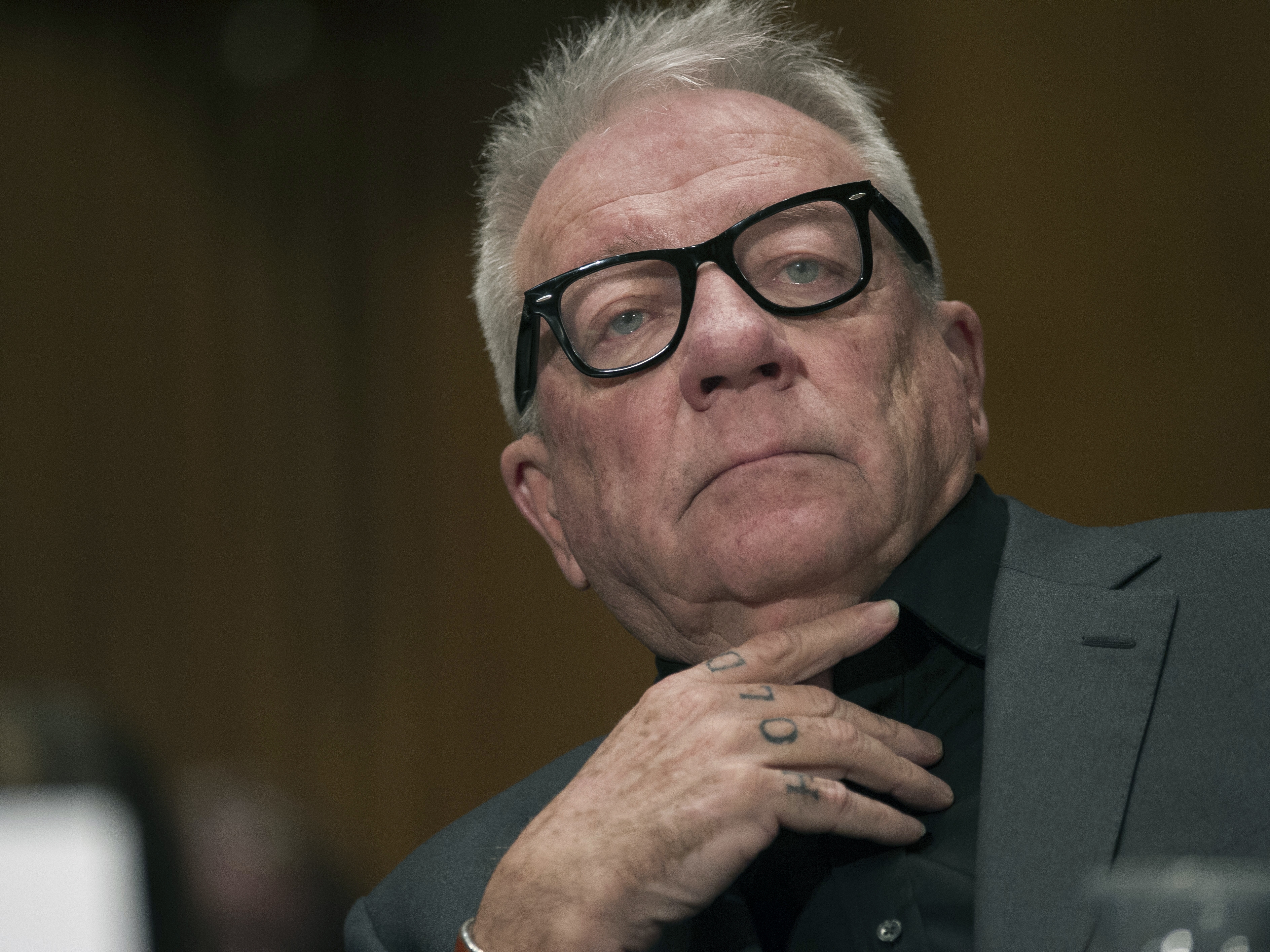 caption: Former Backpage.com owner Michael Lacey attends a Senate committee on Jan. 10, 2017, on Capitol Hill in Washington.