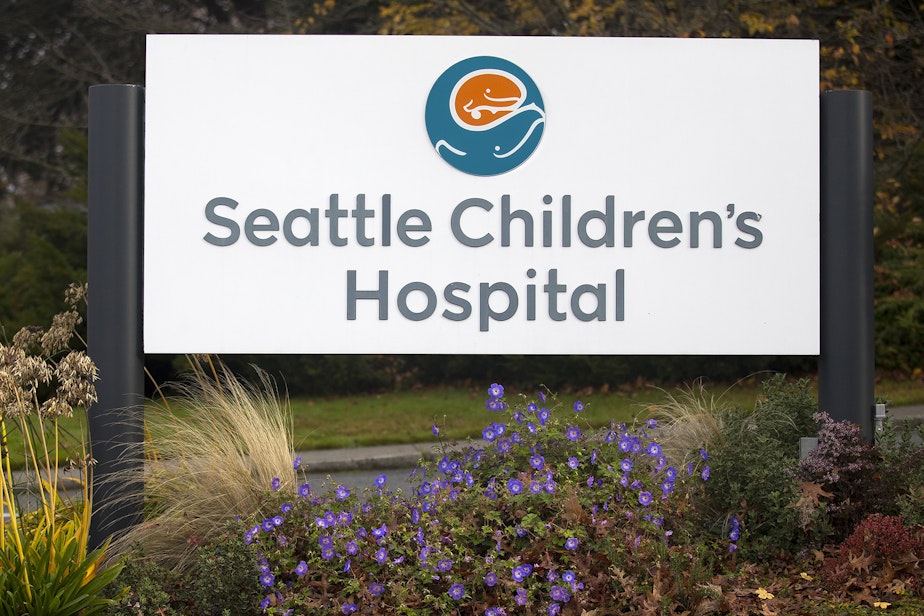 caption: An entrance sign for Seattle Children's Hospital is shown on Thursday, November 14, 2019, in Seattle. 