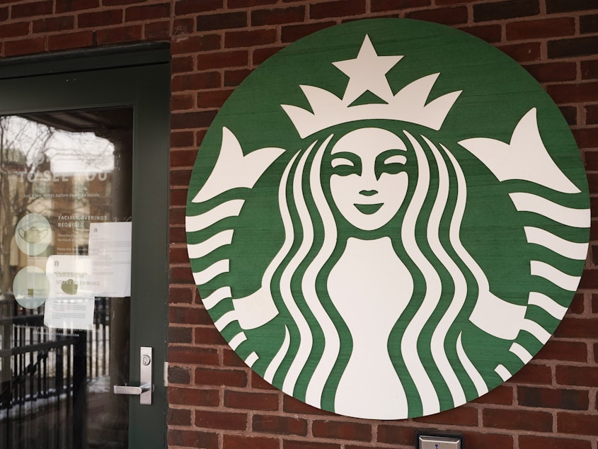 A Starbucks company logo are seen in Palatine, Ill.