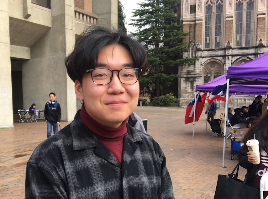 caption: University of Washington sophomore Sicheng Wang on the campus's Red Square