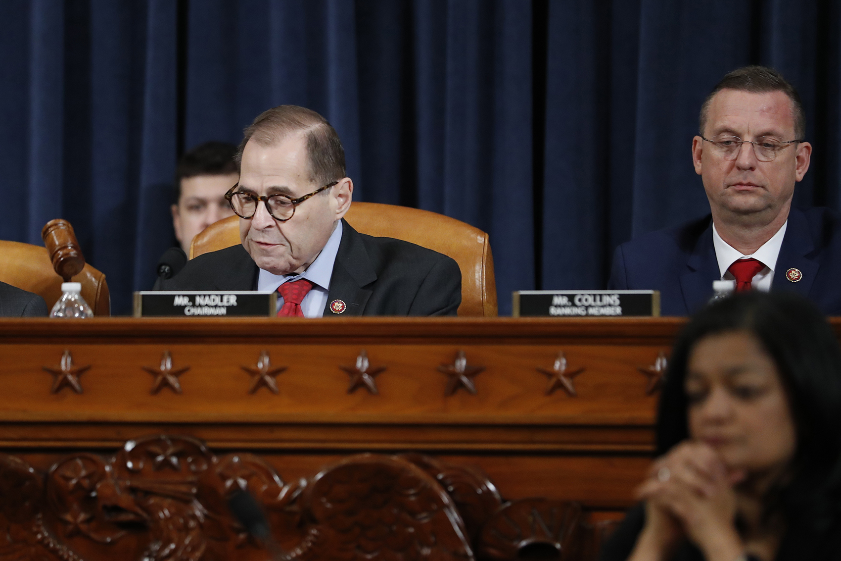 caption: House Judiciary Committee Chairman Rep. Jerrold Nadler, D-N.Y., left, gavels the hearing to a close after the House Judiciary Committee voted on the articles of impeachment against President Donald Trump, Friday, Dec. 13, 2019, on Capitol Hill in Washington. House Judiciary Committee ranking member Rep. Doug Collins, R-Ga., is right. (Andrew Harnik/AP)