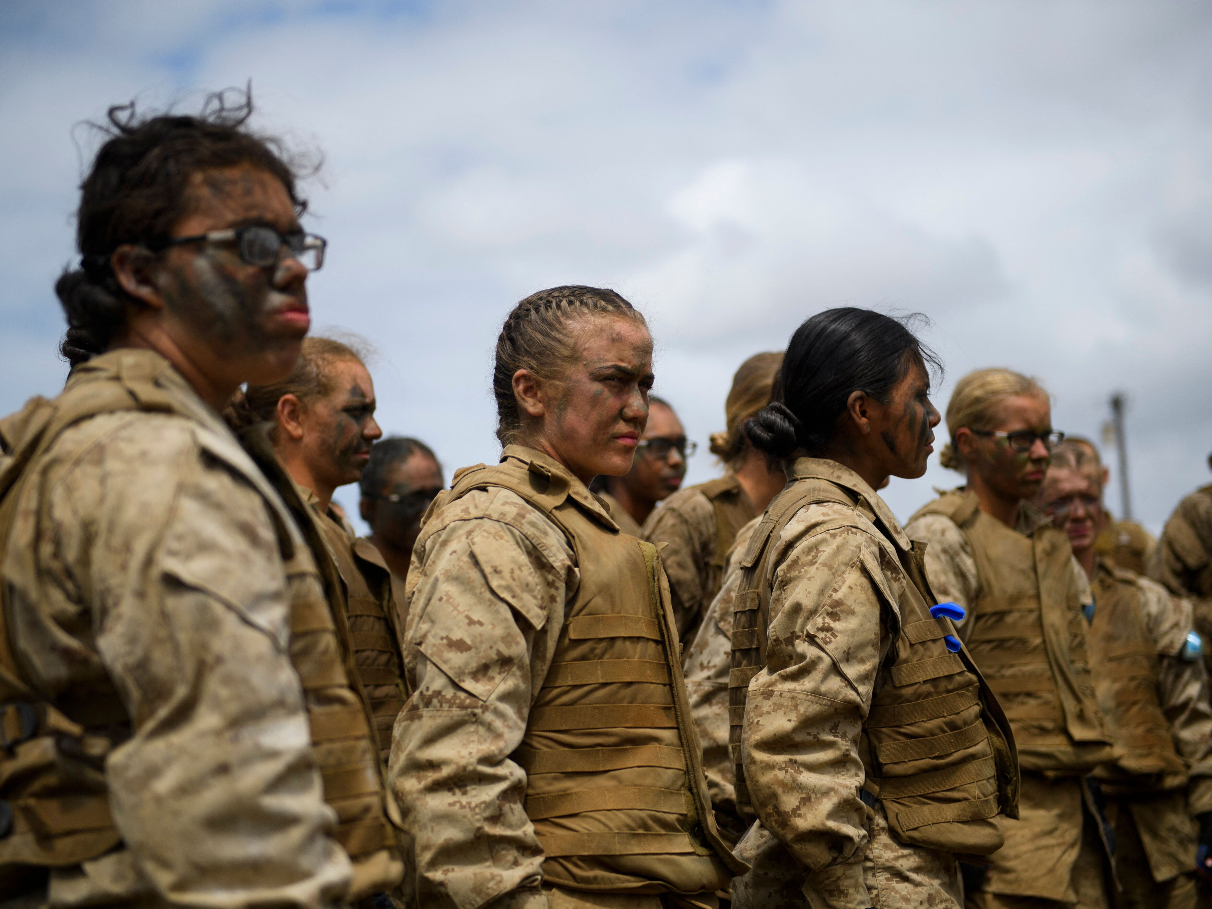 caption: United States Marine Corps recruits from Lima Company, the first gender integrated training class in San Diego, receive a safety briefing on April 21, 2021 at Camp Pendleton in San Diego County, California.