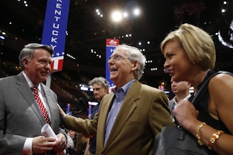 caption: Senate Majority Leader Mitch McConnell speaks with longtime ally Robert "Mike" Duncan, former chairman of the Republican National Committee and current chairman of the USPS Board of Governors, ahead of the 2016 Republican National Convention in Cleveland.