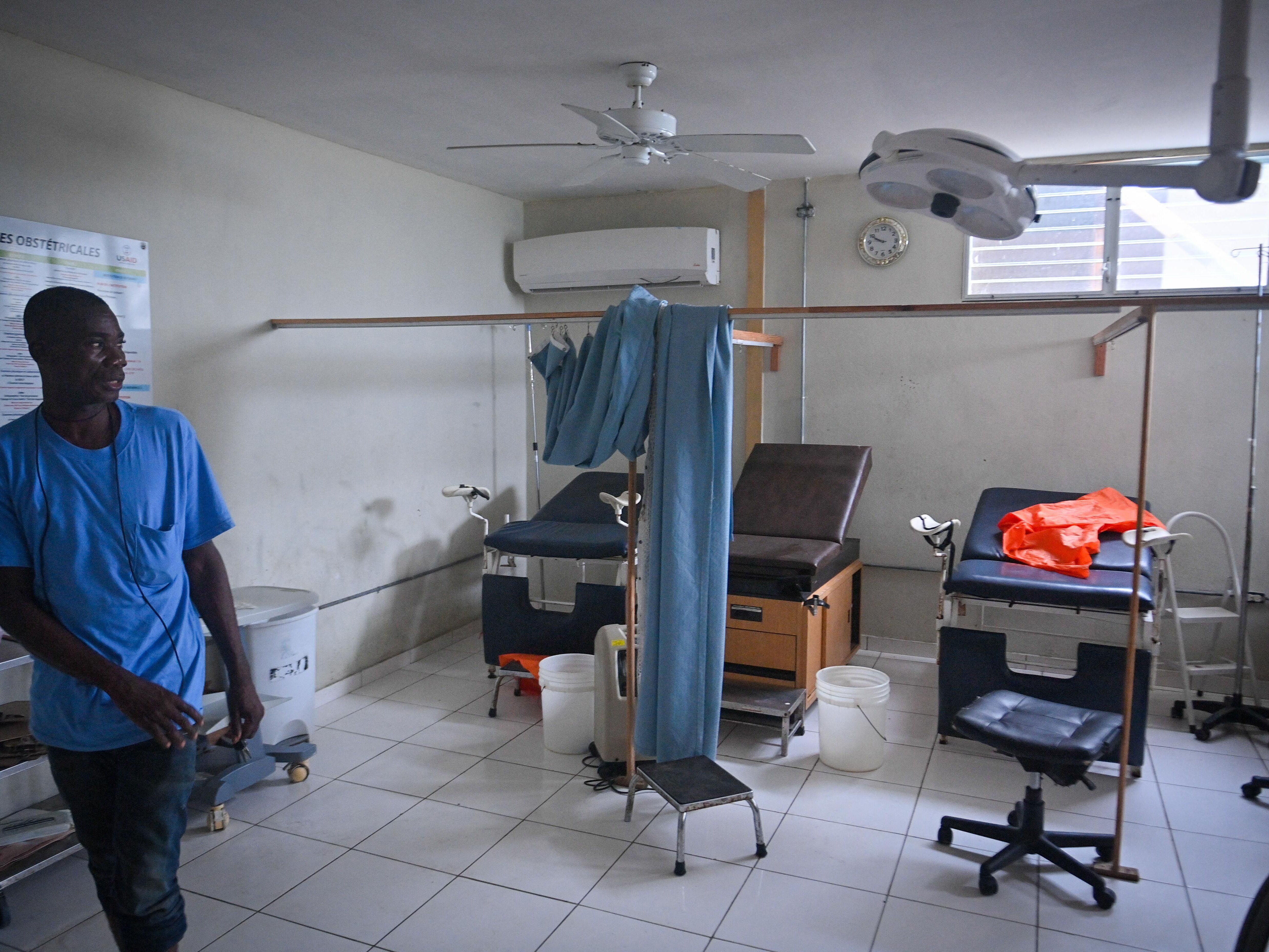 caption: A hospital worker shows the damage inside Fontaine Hospital in Port-au-Prince, Haiti, three days after an armed attack forced its closure last fall.