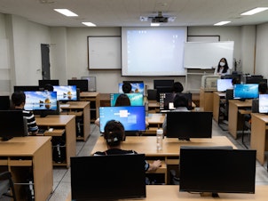 caption: North Korean defectors take a computer class inside Anseong Hanawon, Settlement Support Center for North Korean Refugees, in Anseong, South Korea, July 10.