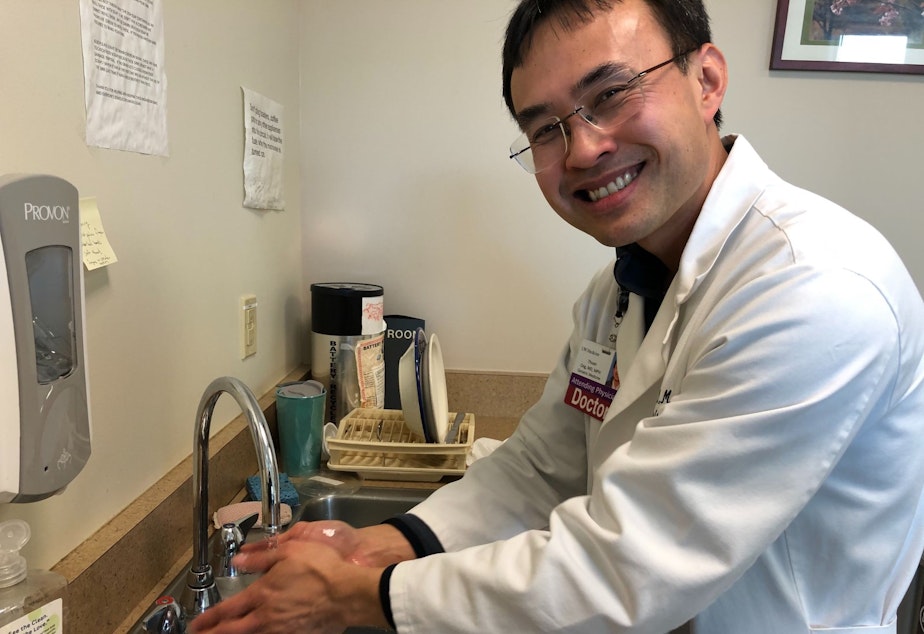 caption: Dr. Thuan Ong demonstrates proper handwashing technique at Harborview Medical Center