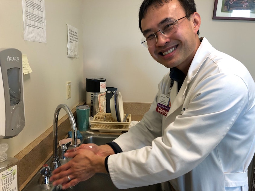 caption: Dr. Thuan Ong demonstrates proper handwashing technique at Harborview Medical Center