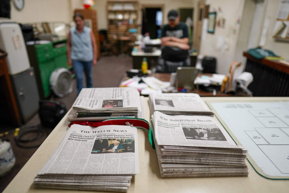 caption: Missy Nester owner of the The Welch News walks around the now closed office on Wednesday, May 31, 2023, in Welch, W.Va. In March, the weekly publication in McDowell County one of the poorest counties America became another one of the quarter of all U.S. newspapers that have shuttered since 2005, a crisis Nester called "terrifying for democracy" and one that disproportionately impacts rural America. (Chris Carlson/AP)