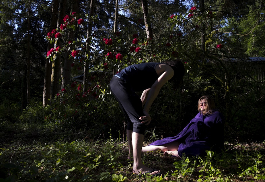 caption: Hope Black breathes through a contraction with her husband Jake, left, while in labor at 7:18 a.m. on Friday, May 28, 2020, in the backyard of their home on Vashon Island. 
