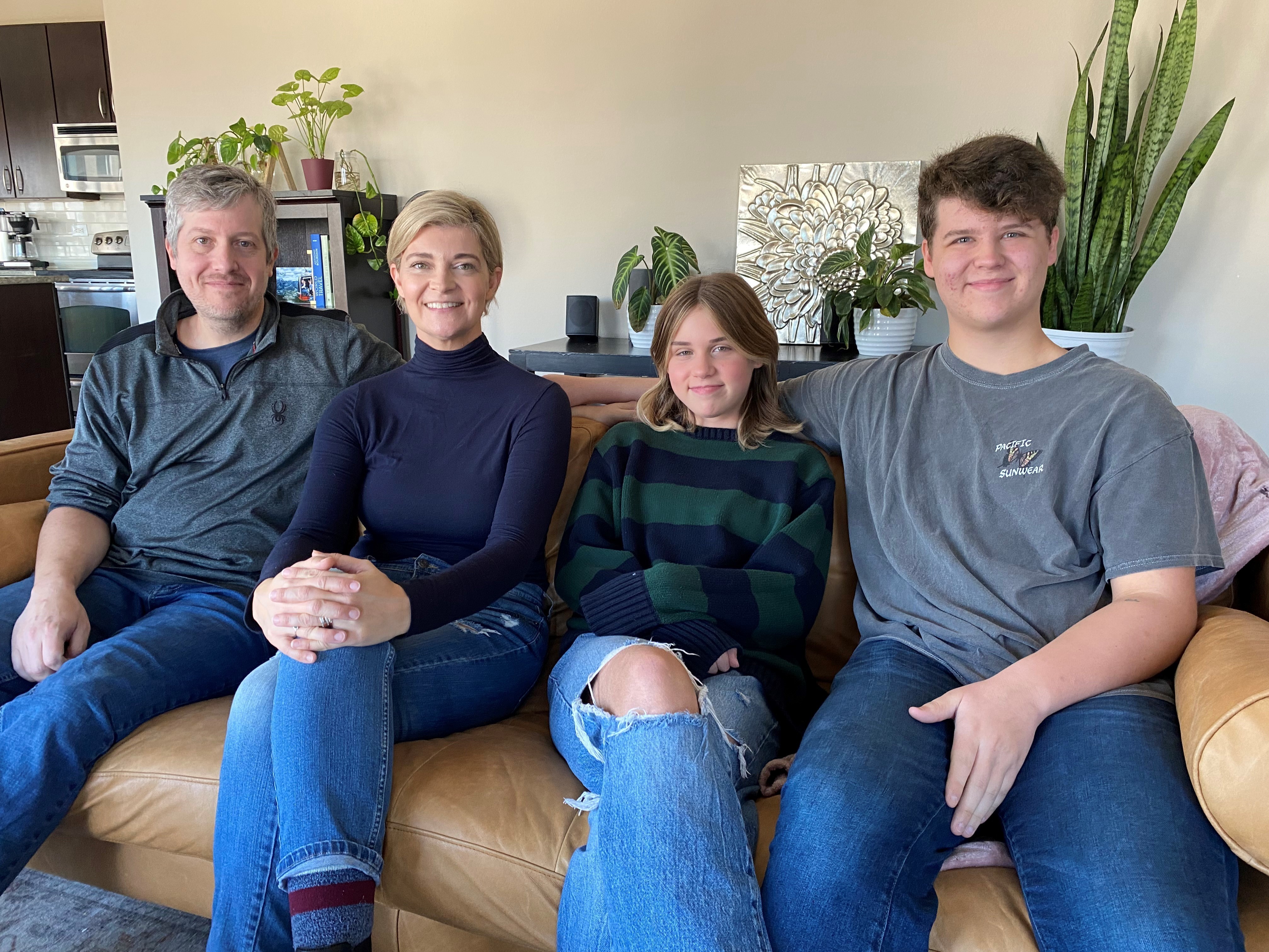 caption: The Wootens recently moved from red Indiana to blue Austin. Left to right: Nate, Tiffany, Mya, and Cole.