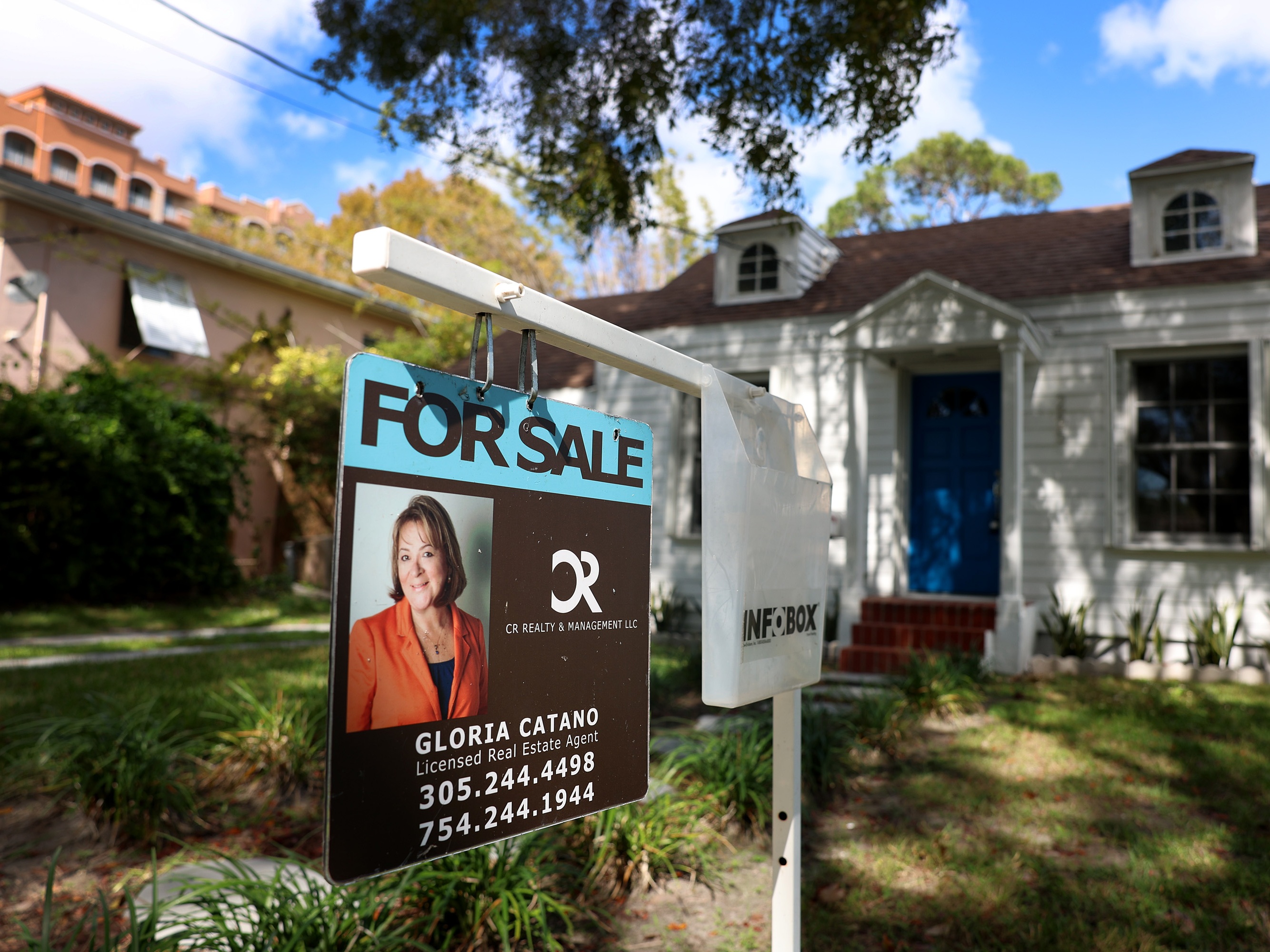 caption: A For Sale sign displayed in front of a home in 2023 in Miami, Fla. Trump administration officials are proposing a 50-year mortgage option.