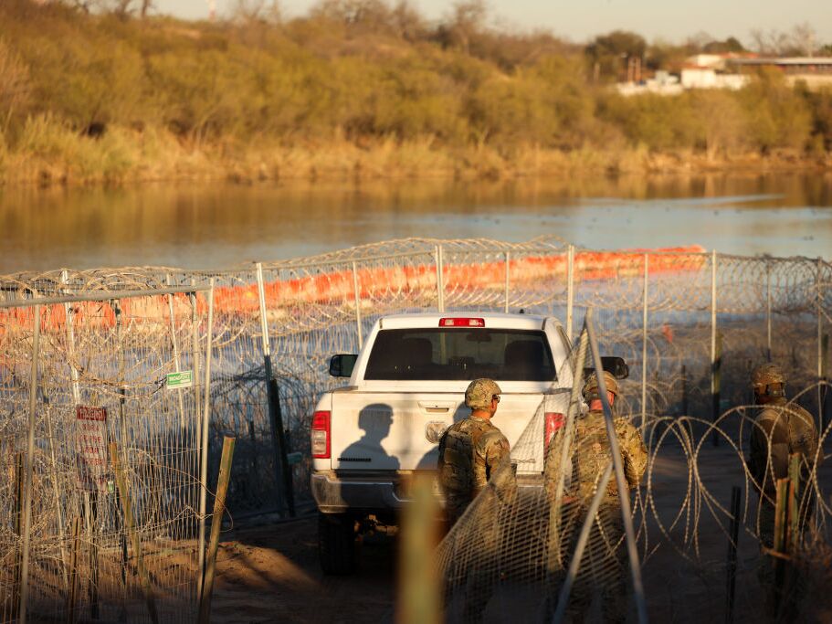 caption: U.S. Army soldiers patrol the U.S.-Mexico border at Eagle Pass, Texas, on Jan. 24. The Trump administration has often used the word invasion to describe illegal immigration, but that framing has not been fully tested in court until now.