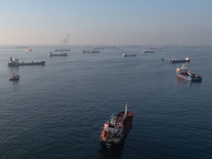 caption: Ships, including those carrying grain from Ukraine and awaiting inspections, are seen anchored off the Istanbul coastline on Wednesday in Istanbul, Turkey.