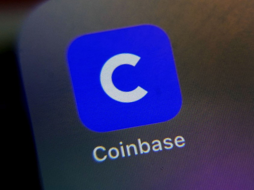 caption: The mobile phone icon for the Coinbase app is shown in New York on April 13, 2021.