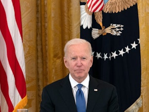 caption: President Biden has allowed a ban on certain kinds of foreign work visas to expire. Above, Biden holds his first cabinet meeting in the East Room of the White House on April 1, 2021.
