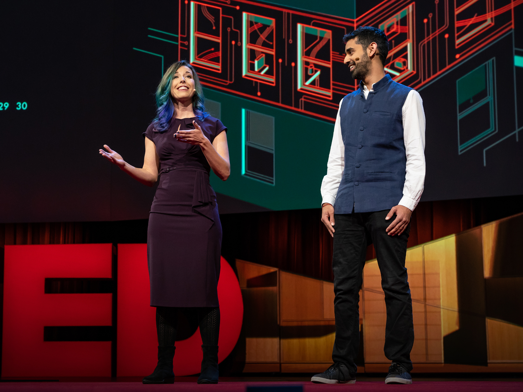 caption: Kashmir Hill and Surya Mattu on the TED stage.