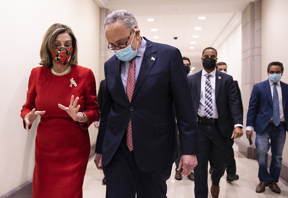 caption: House Speaker Nancy Pelosi, D-Calif., and Senate Minority Leader Chuck Schumer, D-N.Y., speak Sunday following a press conference on Capitol Hill after Republicans and Democrats in the Senate finally came to an agreement on the coronavirus relief bill.