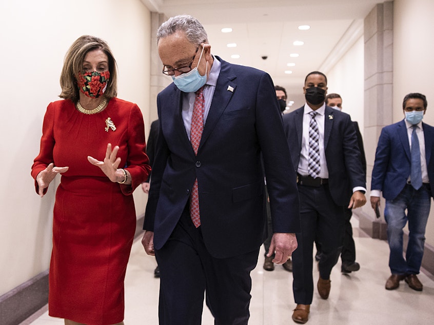 caption: House Speaker Nancy Pelosi, D-Calif., and Senate Minority Leader Chuck Schumer, D-N.Y., speak Sunday following a press conference on Capitol Hill after Republicans and Democrats in the Senate finally came to an agreement on the coronavirus relief bill.