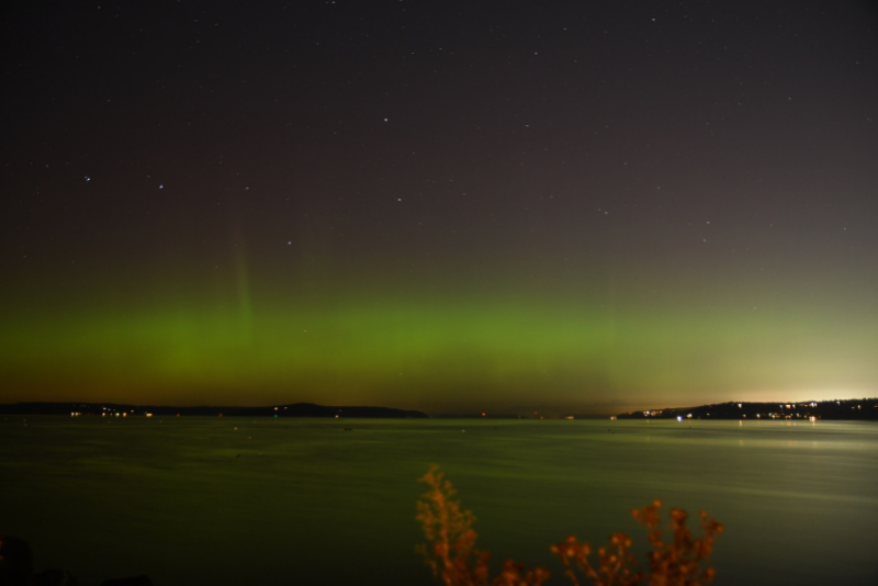 caption: The northern lights seen over Edmonds, Wash. Monday, October 12, 2021. 