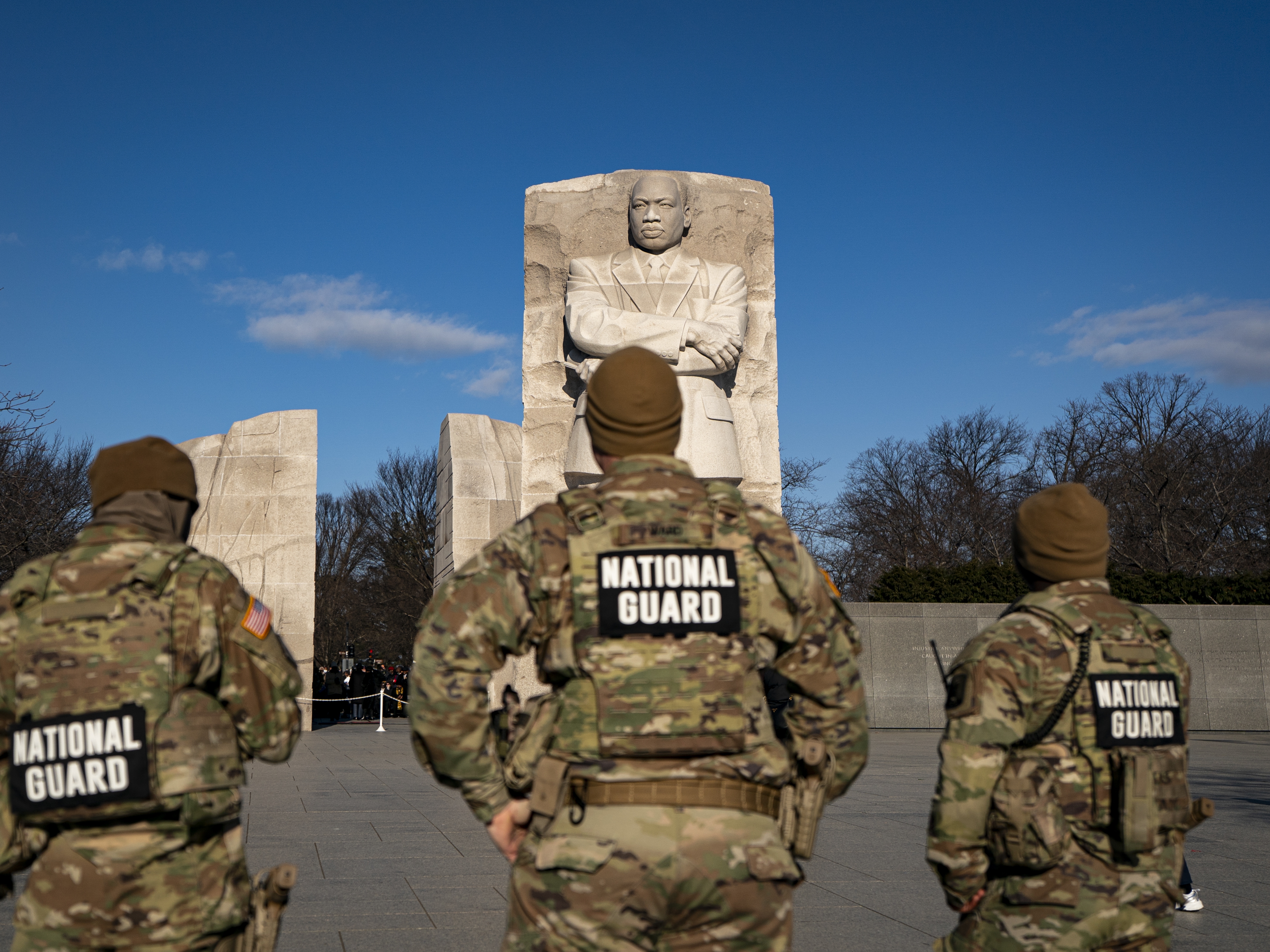 caption: Members of the National Guard stand at the Martin Luther King, Jr. Memorial on Jan. 19 in Washington, D.C.