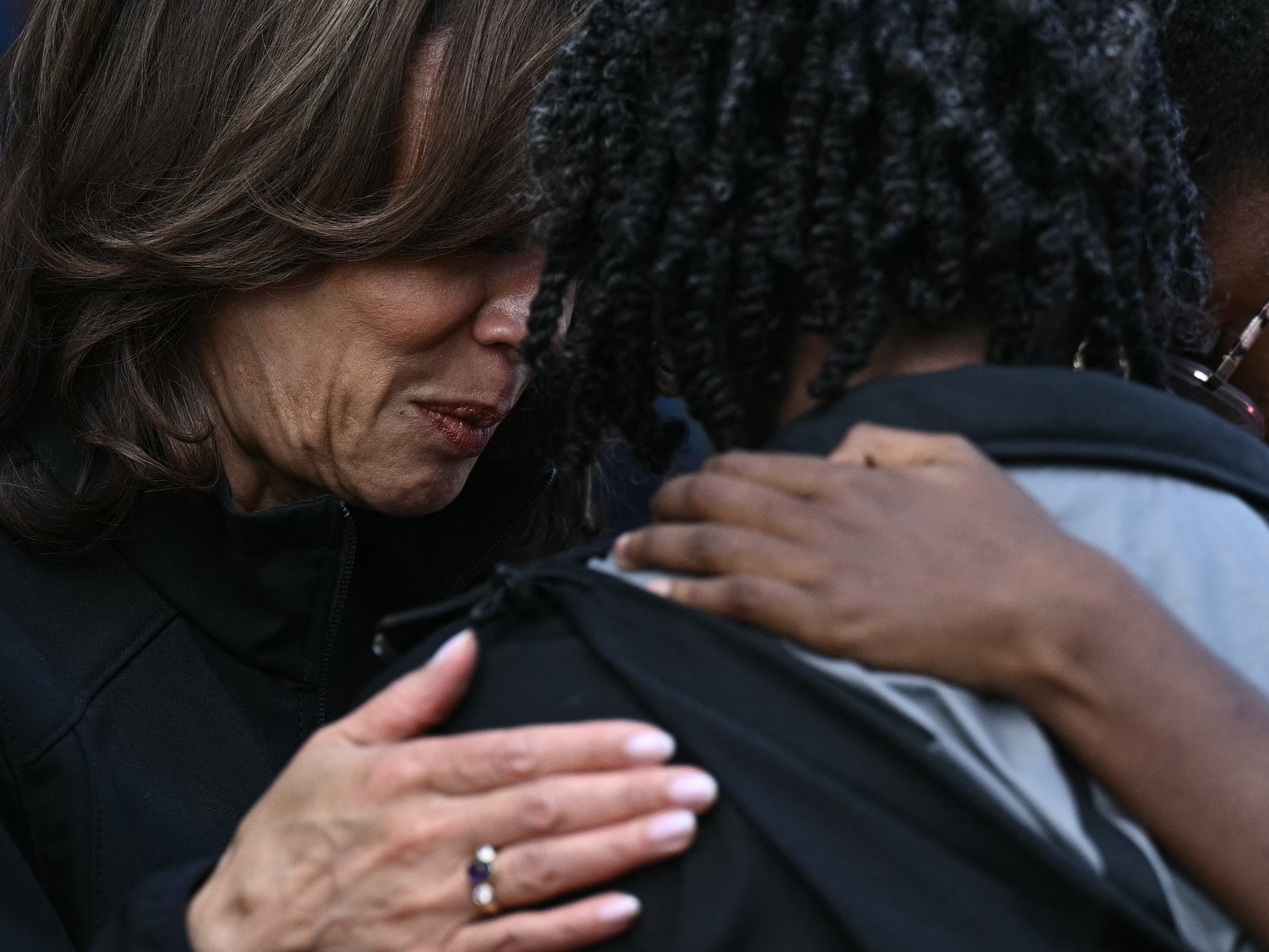 caption: Vice President Harris consoles a woman as she toured damage from Hurricane Helene in the Meadowbrook neighborhood of Augusta, Ga., on Oct. 2.