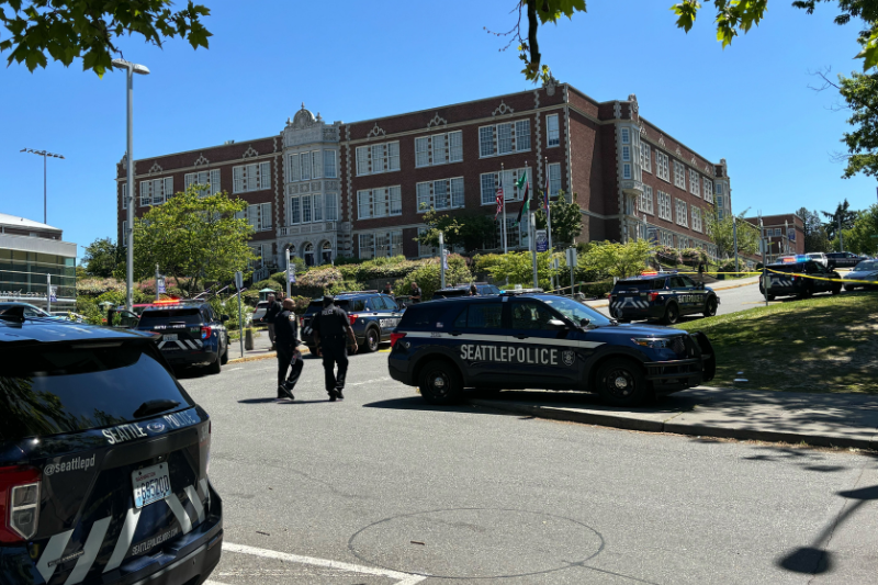 caption: An on-campus shooting at Seattle's Garfield High School put the school in lockdown over the afternoon of Thursday, June 6, 2023. Police blocked off entrances to the school while an investigation was underway. 