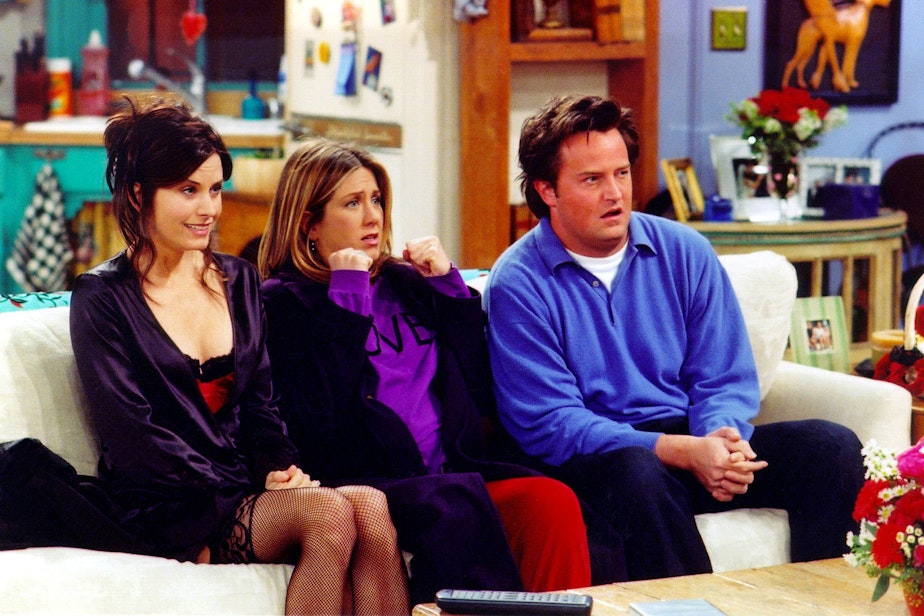 caption: Actors Courteney Cox (left), Jennifer Aniston (center) and Matthew Perry are shown in a scene from the NBC series "Friends". (Warner Bros. Television/Getty Images)