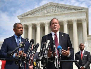 caption: District of Columbia Attorney General Karl Racine (left) and Texas Attorney General Ken Paxton speak Monday about the launch of an antitrust investigation into Google outside the Supreme Court in Washington, D.C.