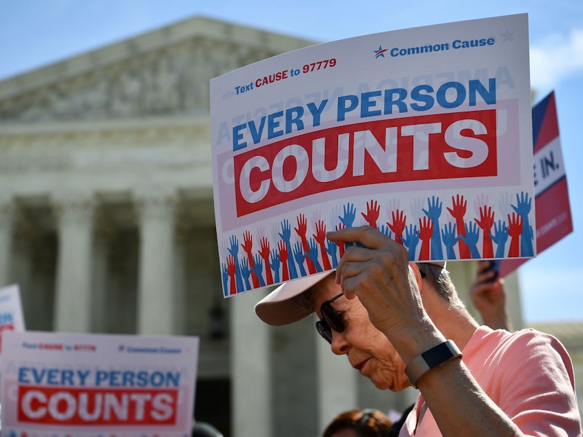 caption: Demonstrators gathered outside the Supreme Court Tuesday to protest the Trump administration's proposal to add a citizenship question to the 2020 Census.