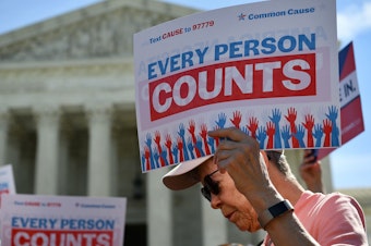 caption: Demonstrators gathered outside the Supreme Court Tuesday to protest the Trump administration's proposal to add a citizenship question to the 2020 Census.