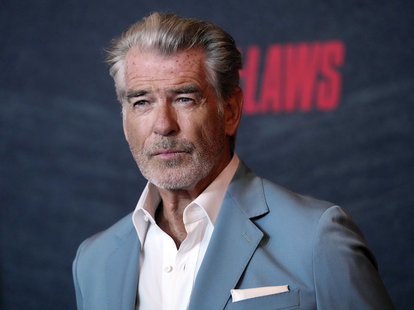 caption: Pierce Brosnan, a cast member in "The Out-Laws," poses at a screening of the film, on June 26, 2023, in Los Angeles. Brosnan pleaded guilty Thursday to stepping out of bounds in a thermal area during a November 2023 visit to Yellowstone National Park.