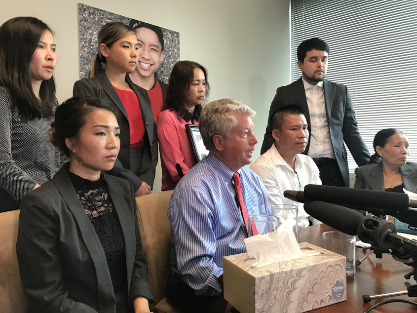 caption: Tommy Le's family and attorneys at a news conference in 2017. The family has sought more rights in the inquest process. 