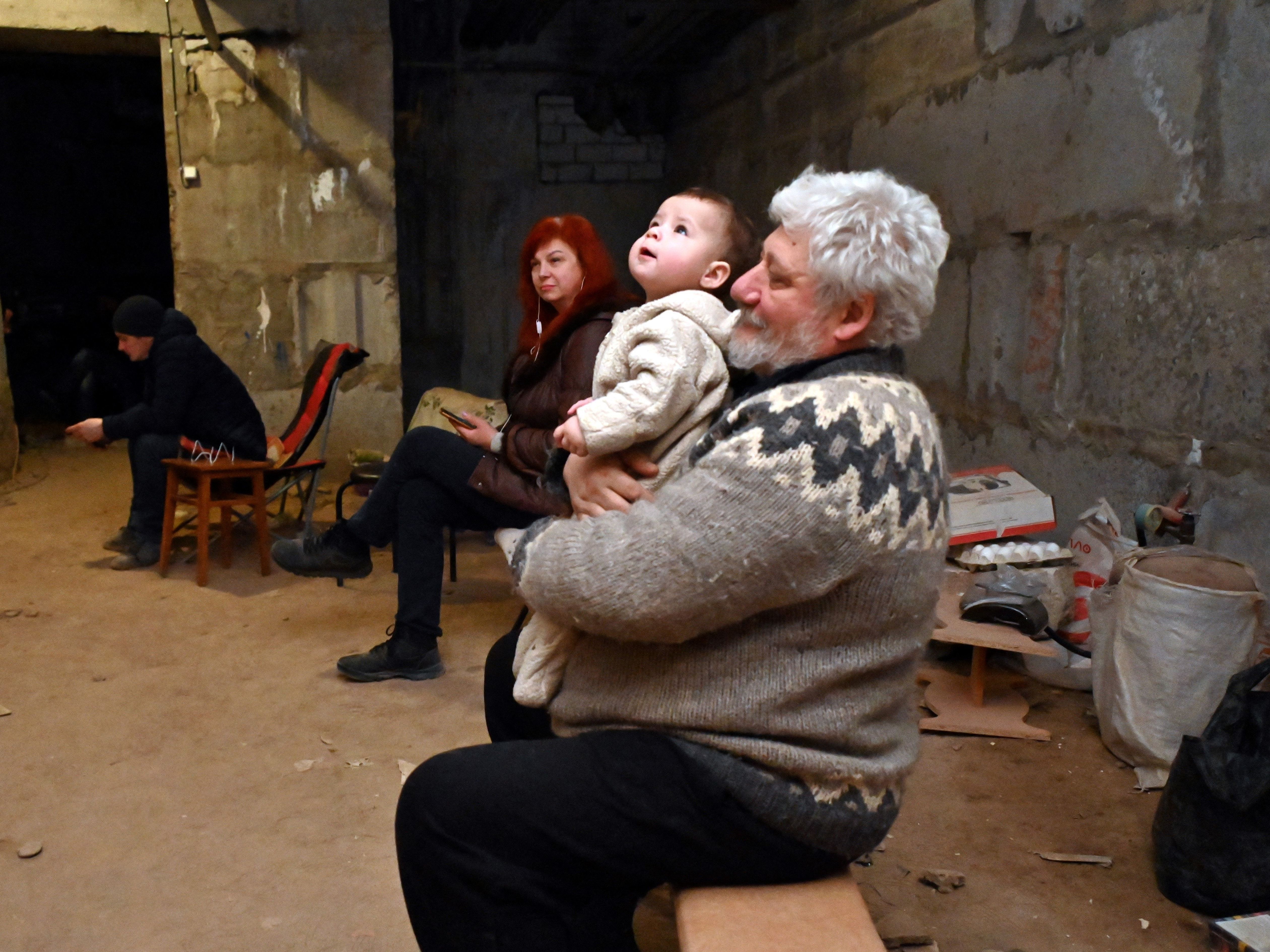 caption: Ukrainians in the eastern city of Kharkiv take shelter in a basement on Sunday. The city, which is close to the Russian border, has been hard hit throughout the Russian invasion. Residents are bracing for a new Russian offensive in the eastern part of Ukraine.