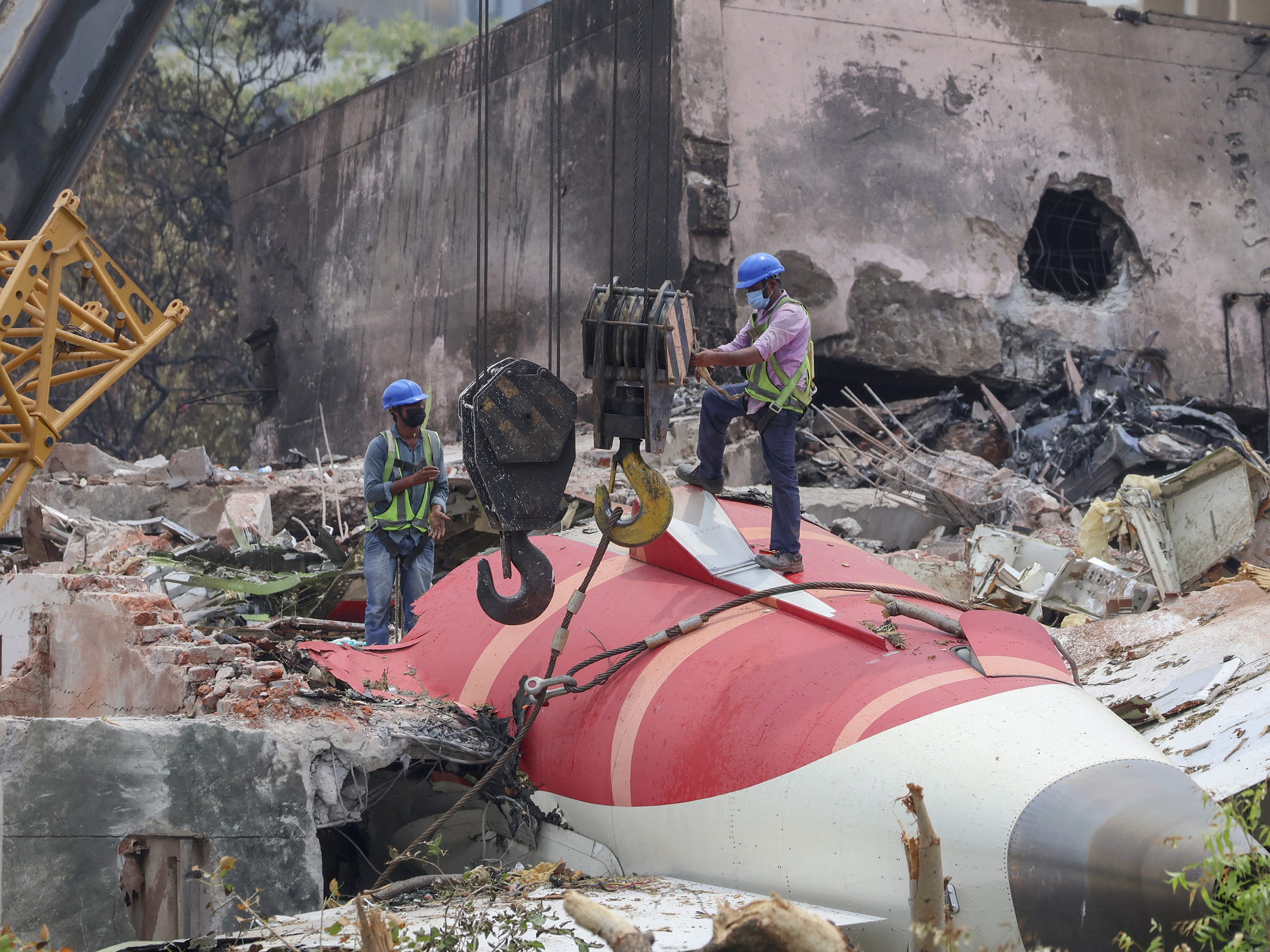 caption: Members of the Indian Army's engineering team prepare to remove the wreckage of an Air India Boeing 787 Dreamliner aircraft, bound for London's Gatwick Airport, which crashed during take-off from an airport in Ahmedabad, India June 14, 2025.