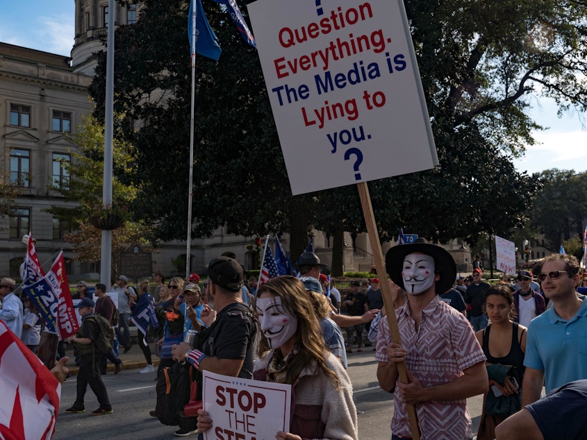 caption: Supporters of President Trump host a 'Stop the Steal' protest outside of the Georgia State Capital building on Nov. 21, 2020.