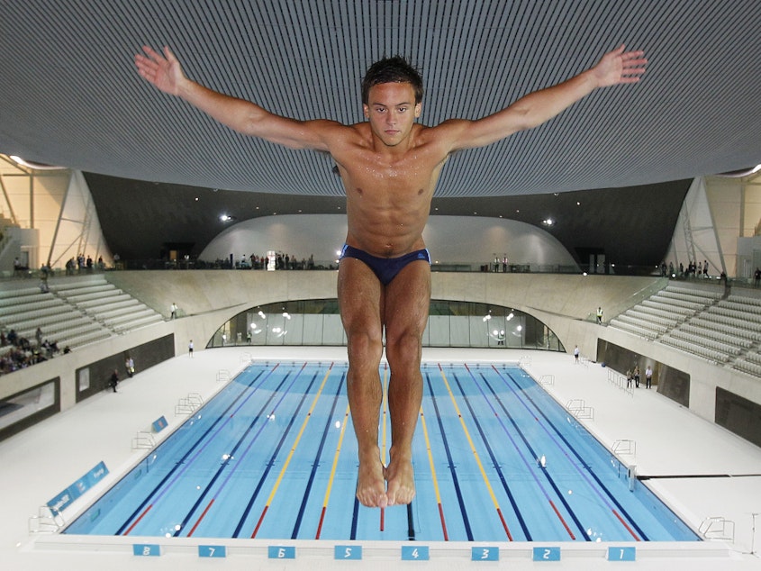 caption: British Olympic diver Tom Daley won his first gold medal on Monday after competing in three other Olympic games.