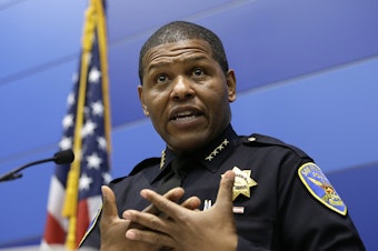 caption: San Francisco Police Chief William Scott answers questions during a May 21 news conference. Scott has apologized for a raid on a freelance journalist's home.