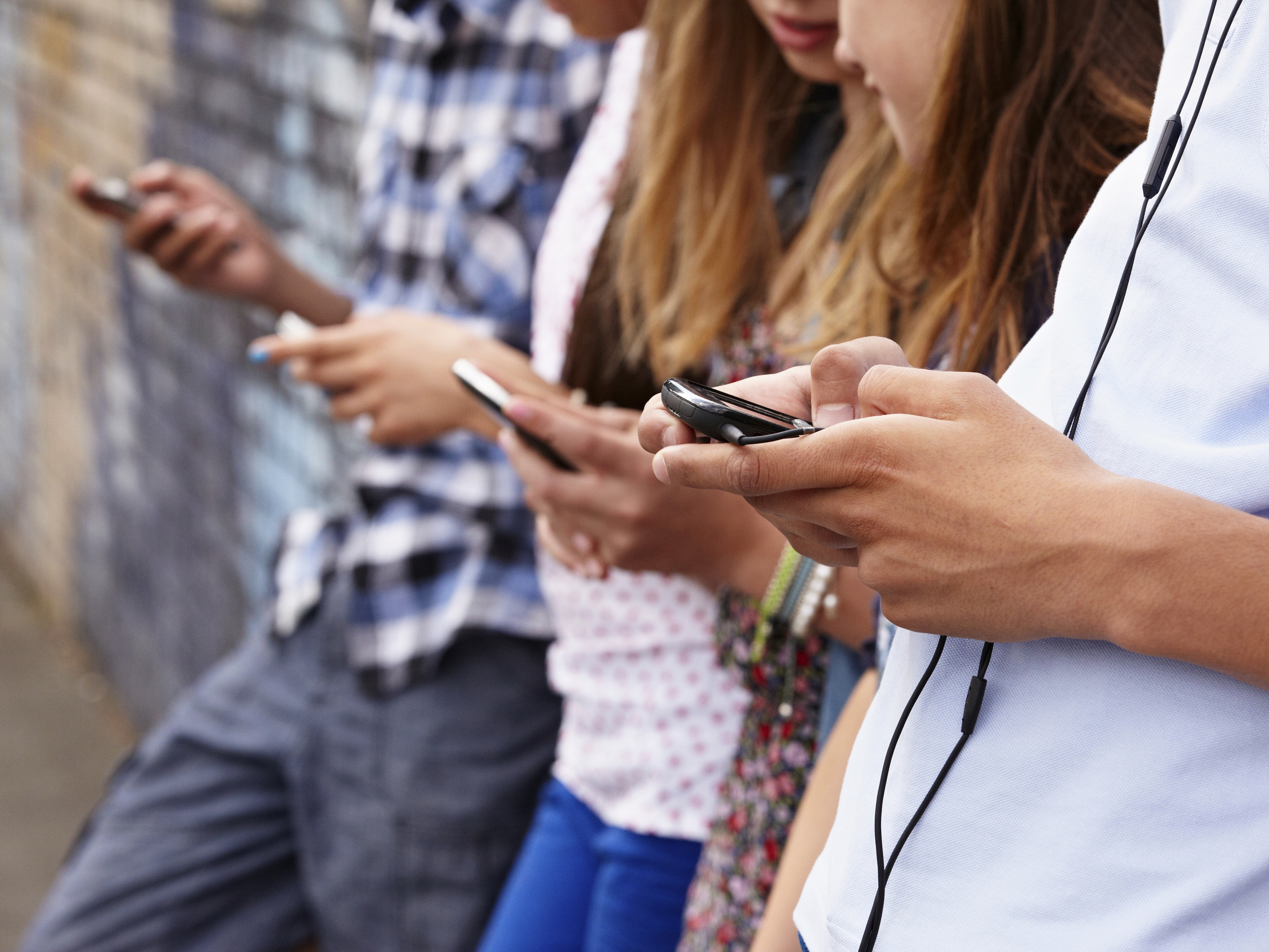 Teenagers using cellphones