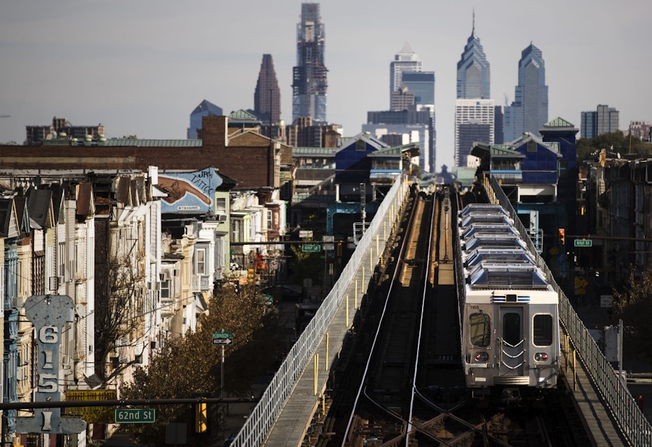 caption: A train moves along the Market-Frankford Line in Philadelphia on Oct. 26, 2016. (Matt Rourke/AP)